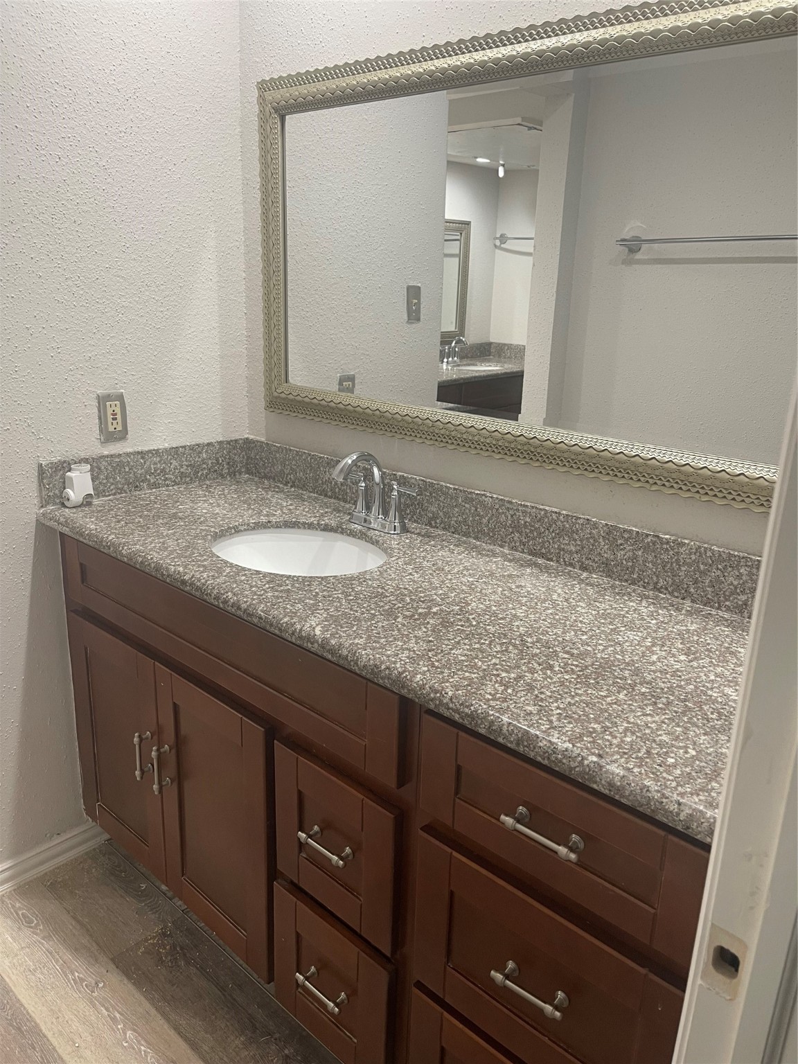 10912 Gulf Freeway, Unit 73 Houston, TX 77075 - Photo 3 of 27 a bathroom with a granite countertop sink and a mirror