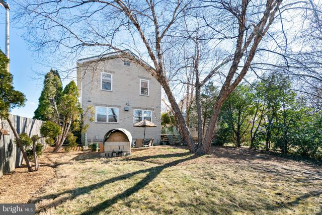 a kitchen with stainless steel appliances a sink a stove and a window