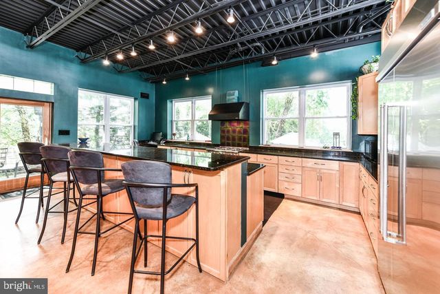 a living room with a bed furniture and a window