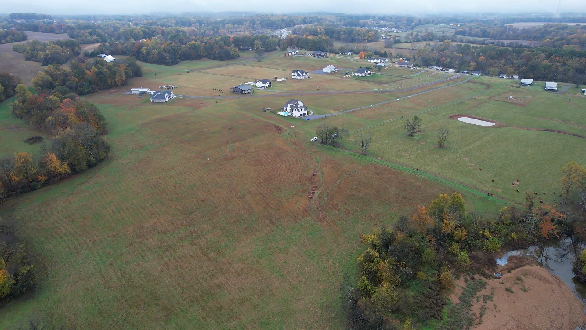 an aerial view of a houses with yard