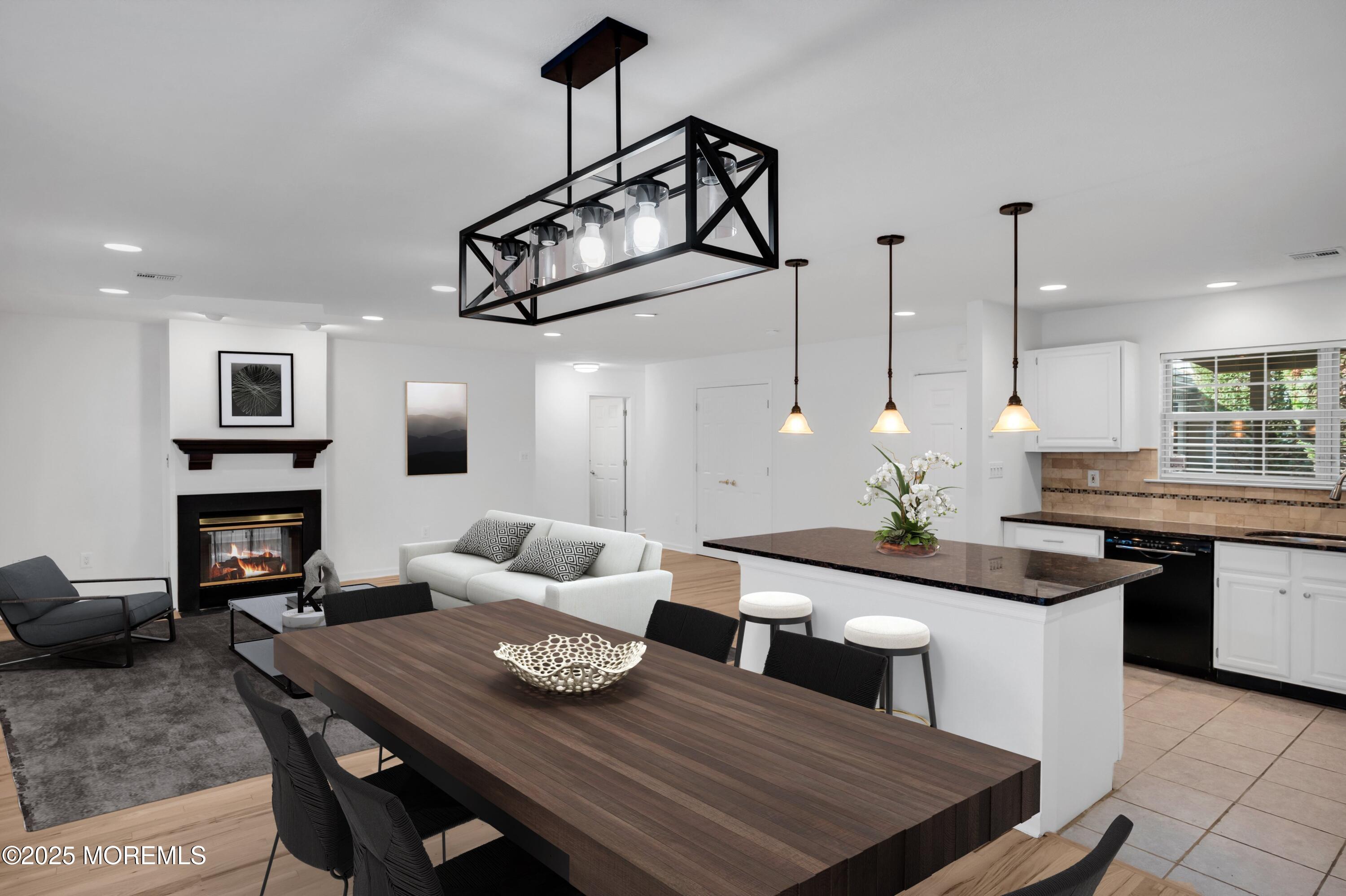 9 Ambrose Lane, Unit 141 Holmdel, NJ 07733 - Photo 1 of 50 a living room with furniture and wooden floor
