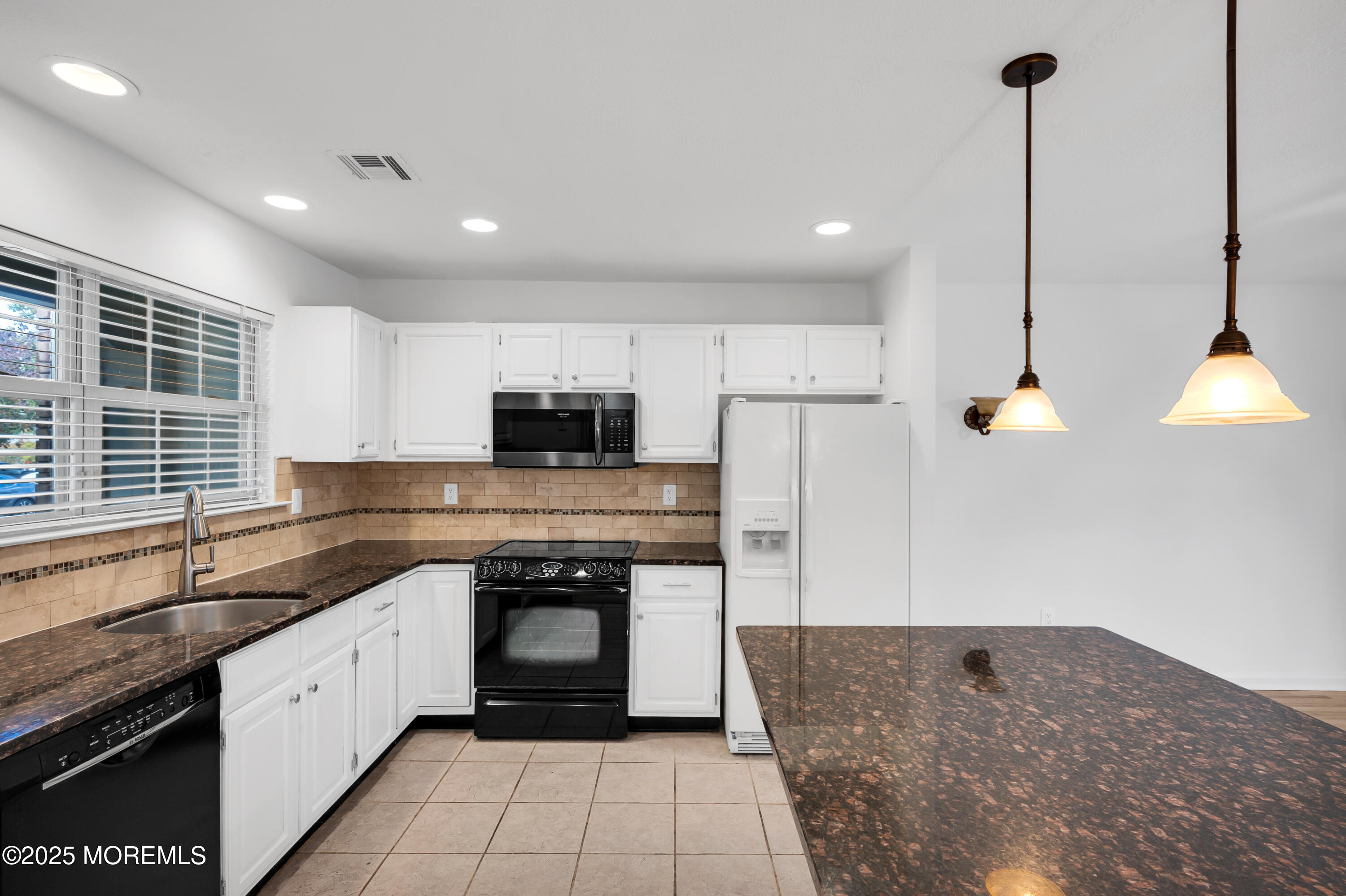 9 Ambrose Lane, Unit 141 Holmdel, NJ 07733 - Photo 13 of 50 a large kitchen with stainless steel appliances granite countertop a sink a stove and a granite counter tops