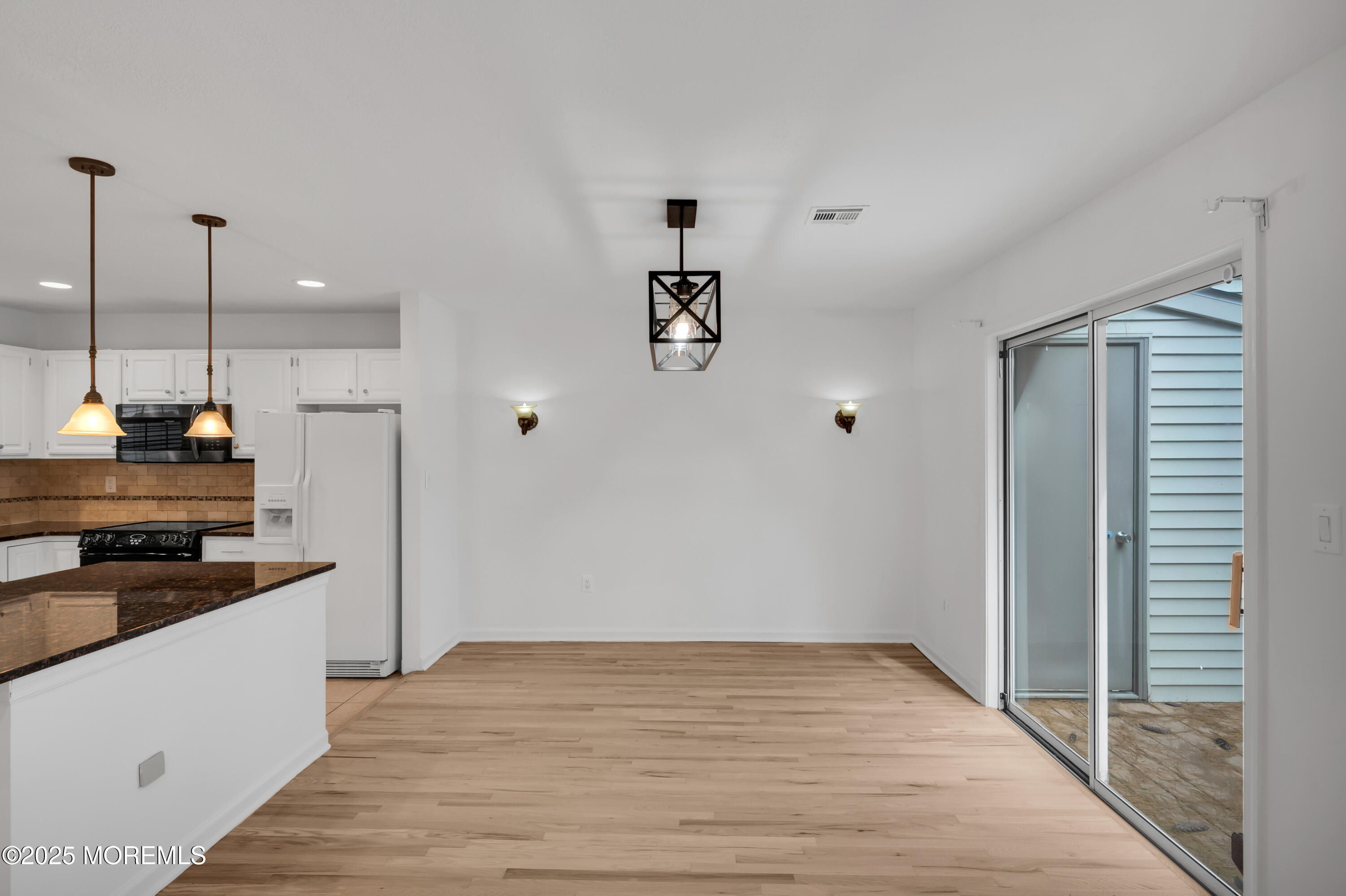 9 Ambrose Lane, Unit 141 Holmdel, NJ 07733 - Photo 19 of 50 a kitchen with a sink and a refrigerator
