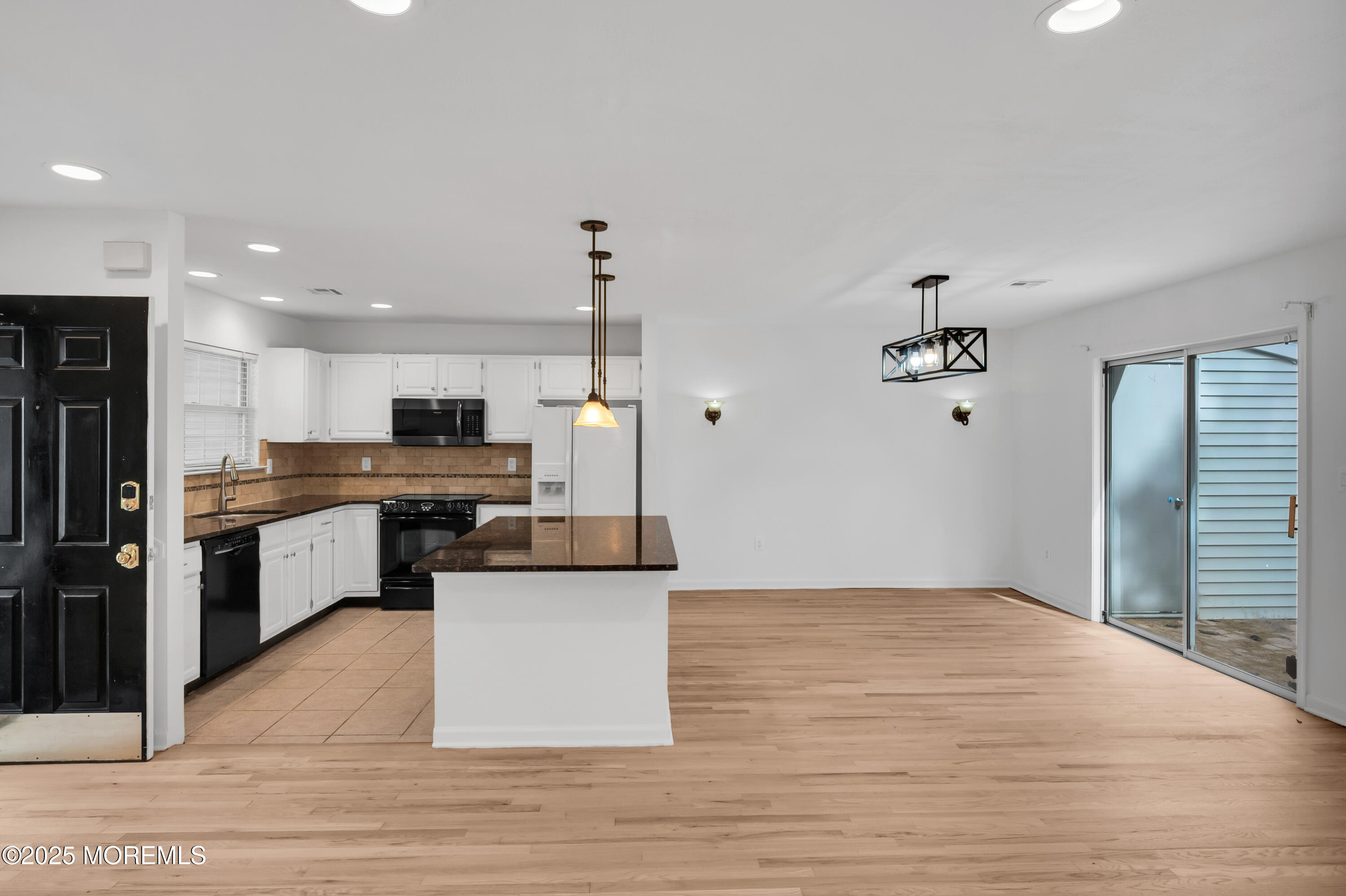 9 Ambrose Lane, Unit 141 Holmdel, NJ 07733 - Photo 23 of 50 a kitchen with stainless steel appliances kitchen island sink refrigerator and stove