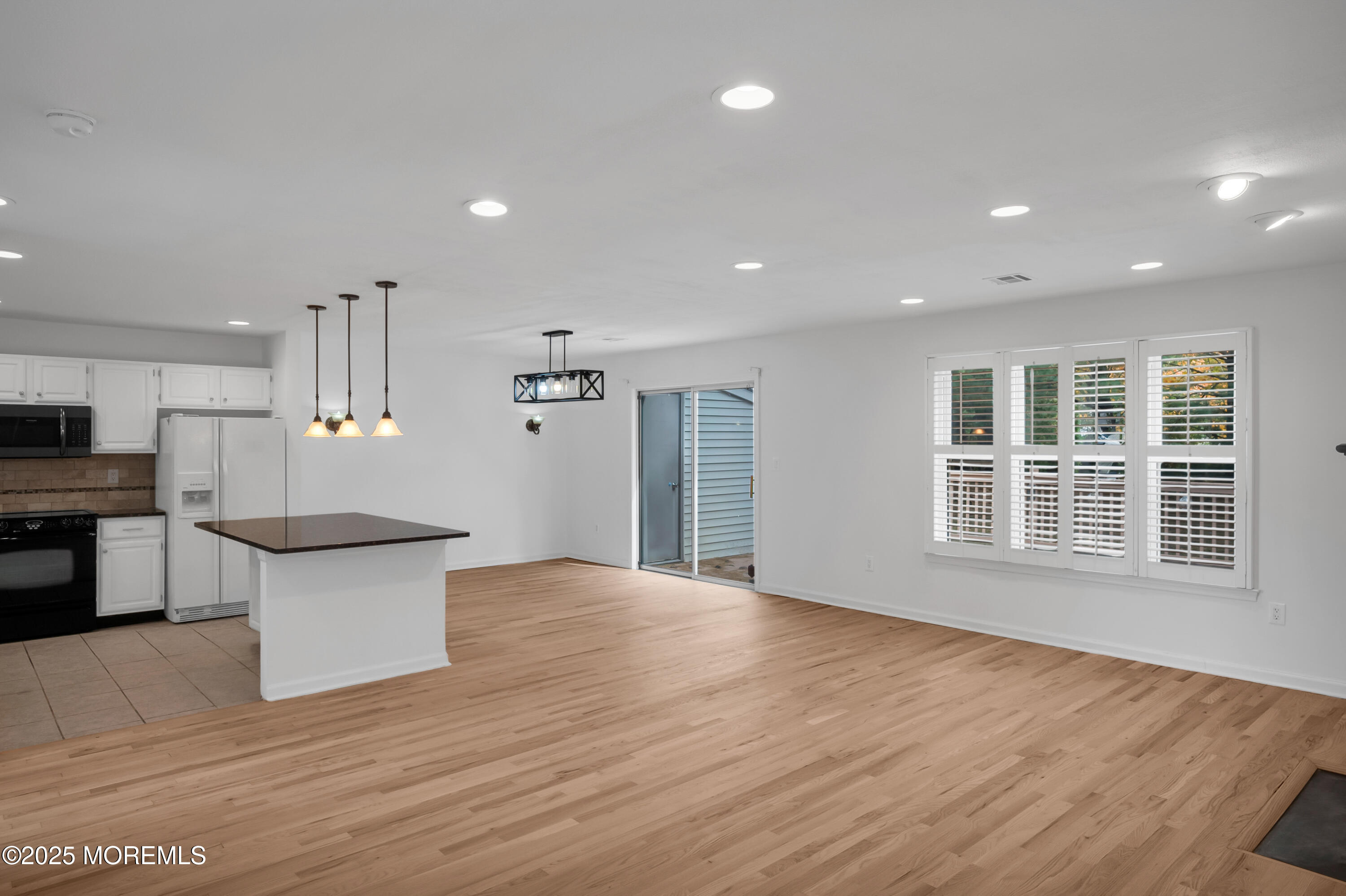 9 Ambrose Lane, Unit 141 Holmdel, NJ 07733 - Photo 24 of 50 a view of a kitchen with a sink and a refrigerator