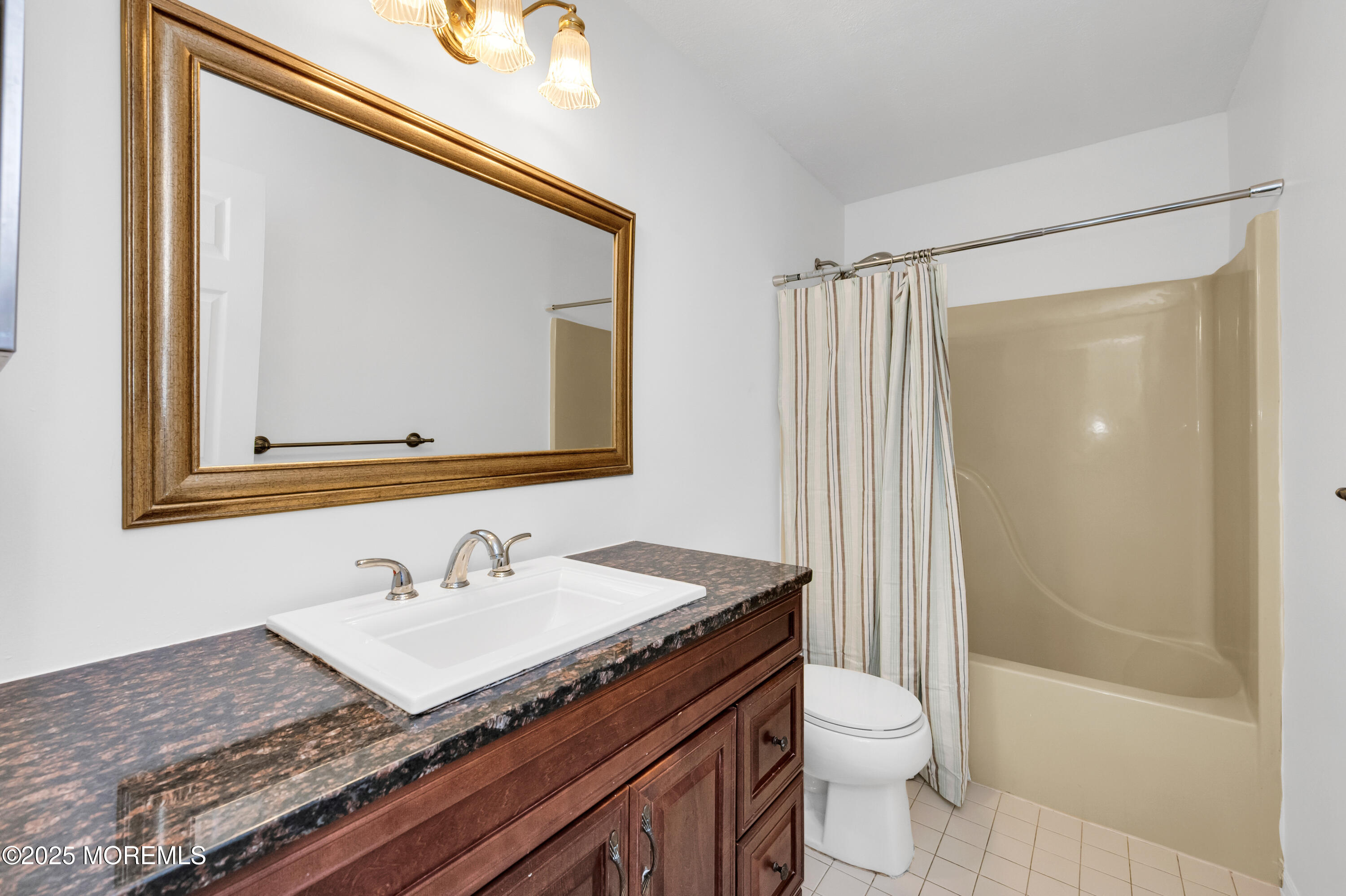 9 Ambrose Lane, Unit 141 Holmdel, NJ 07733 - Photo 29 of 50 a bathroom with a granite countertop sink toilet and shower
