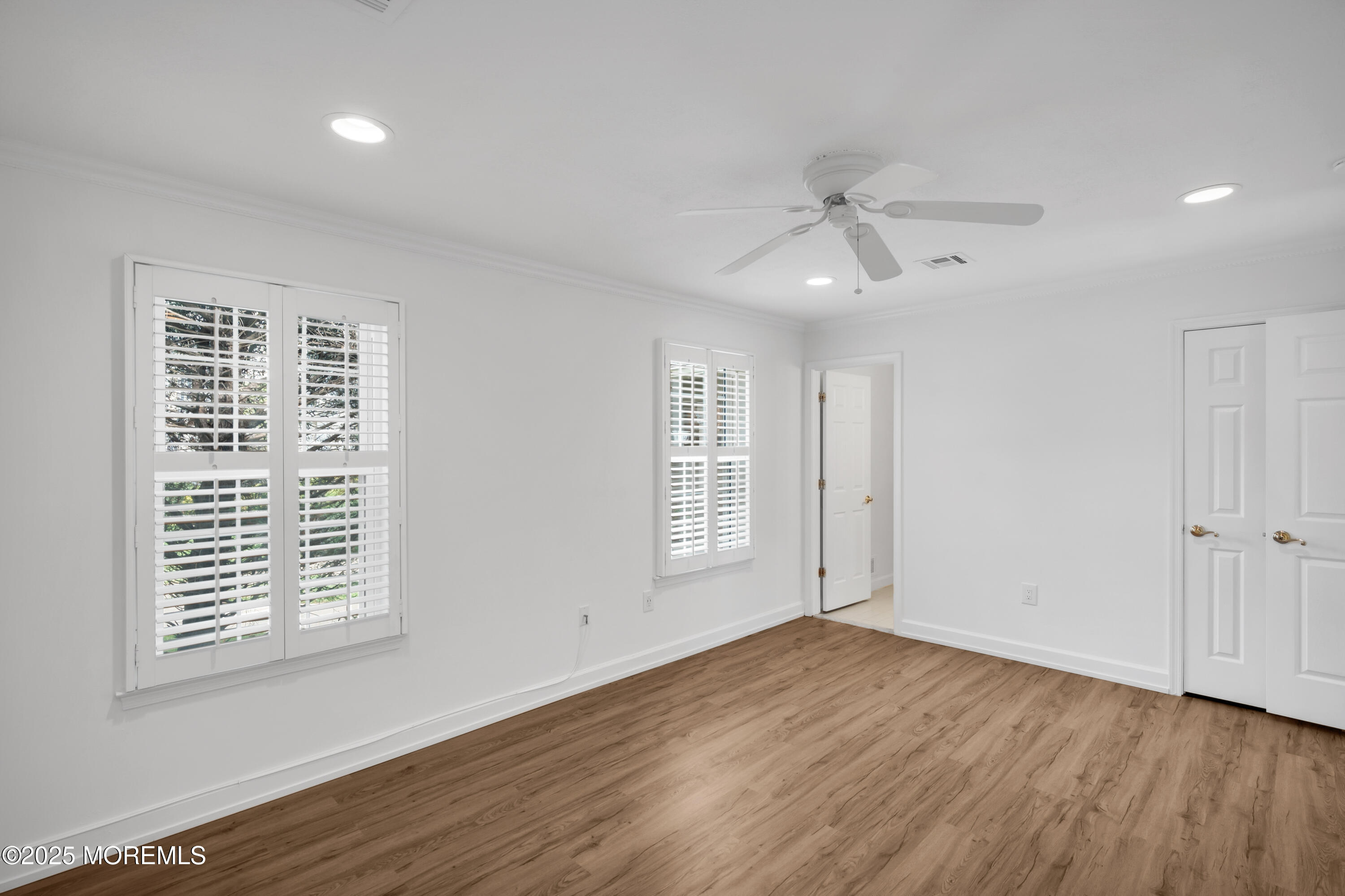 9 Ambrose Lane, Unit 141 Holmdel, NJ 07733 - Photo 36 of 50 wooden floor in an empty room with a window