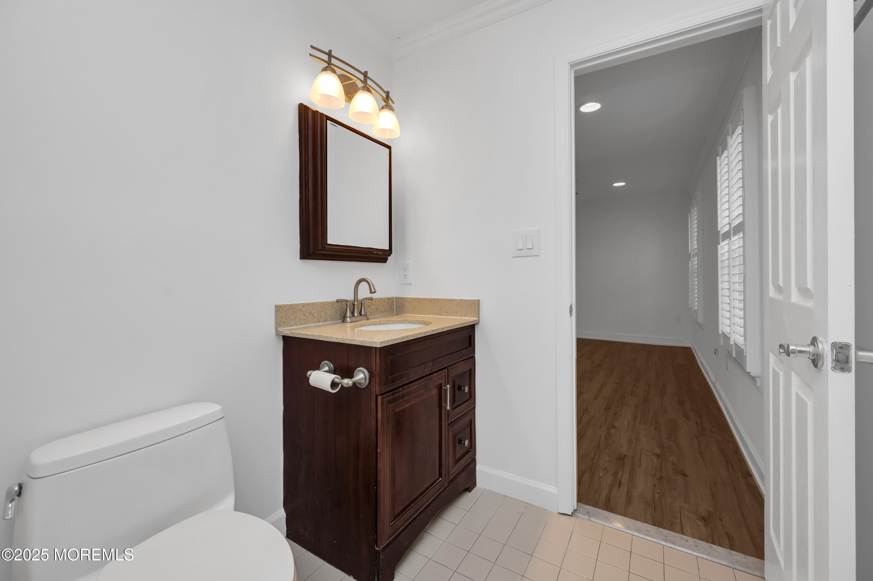 9 Ambrose Lane, Unit 141 Holmdel, NJ 07733 - Photo 41 of 50 a bathroom with a toilet a sink and mirror