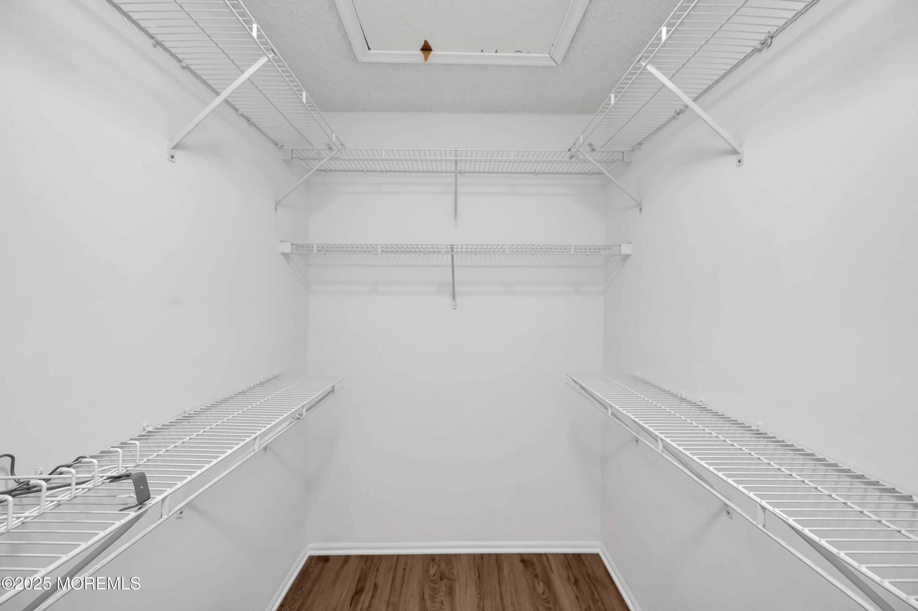 9 Ambrose Lane, Unit 141 Holmdel, NJ 07733 - Photo 42 of 50 a view of a hallway with closet