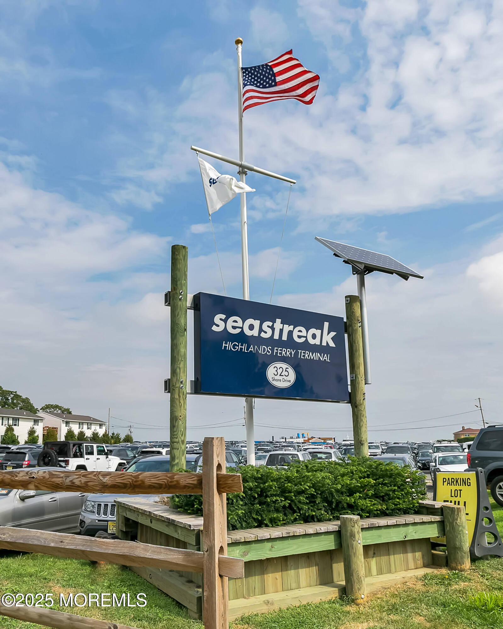 9 Ambrose Lane, Unit 141 Holmdel, NJ 07733 - Photo 45 of 50 a sign that is on a pole on a street