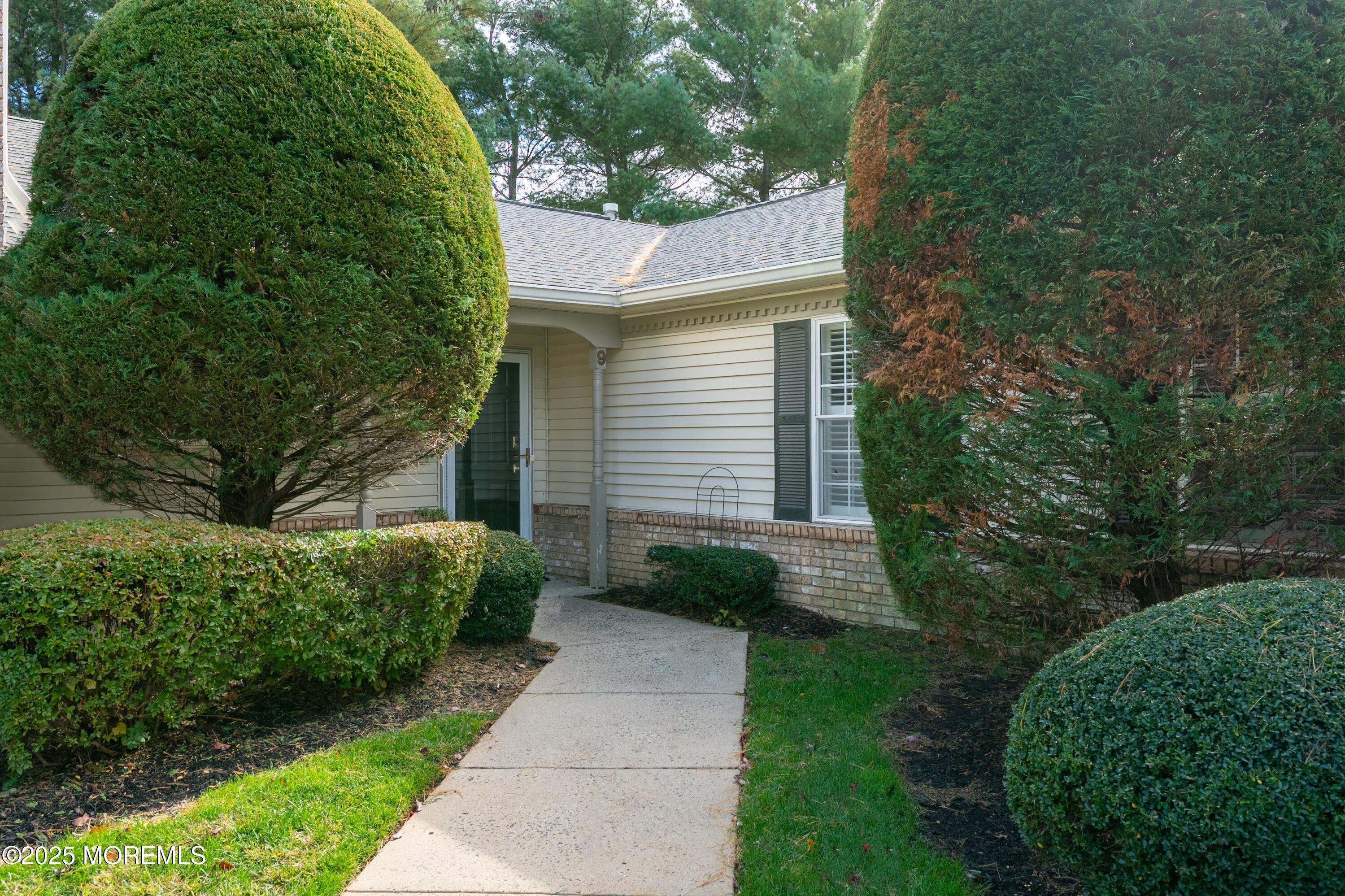 9 Ambrose Lane, Unit 141 Holmdel, NJ 07733 - Photo 9 of 50 a view of a pathway with a house