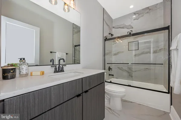 a living room with fireplace furniture and a flat screen tv