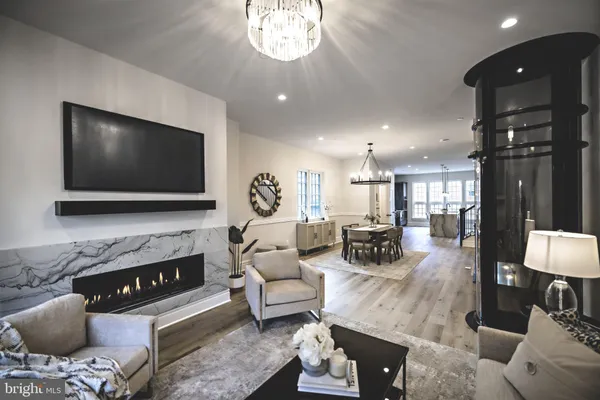 a kitchen with stainless steel appliances granite countertop a sink a stove and a wooden floors