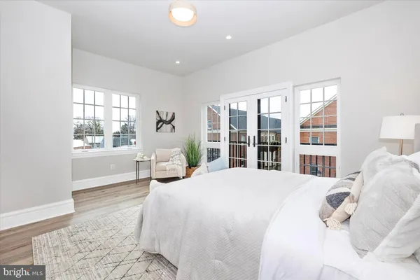 a living room with furniture a chandelier and a couch