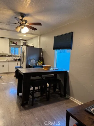 a kitchen with stainless steel appliances a stove refrigerator and microwave