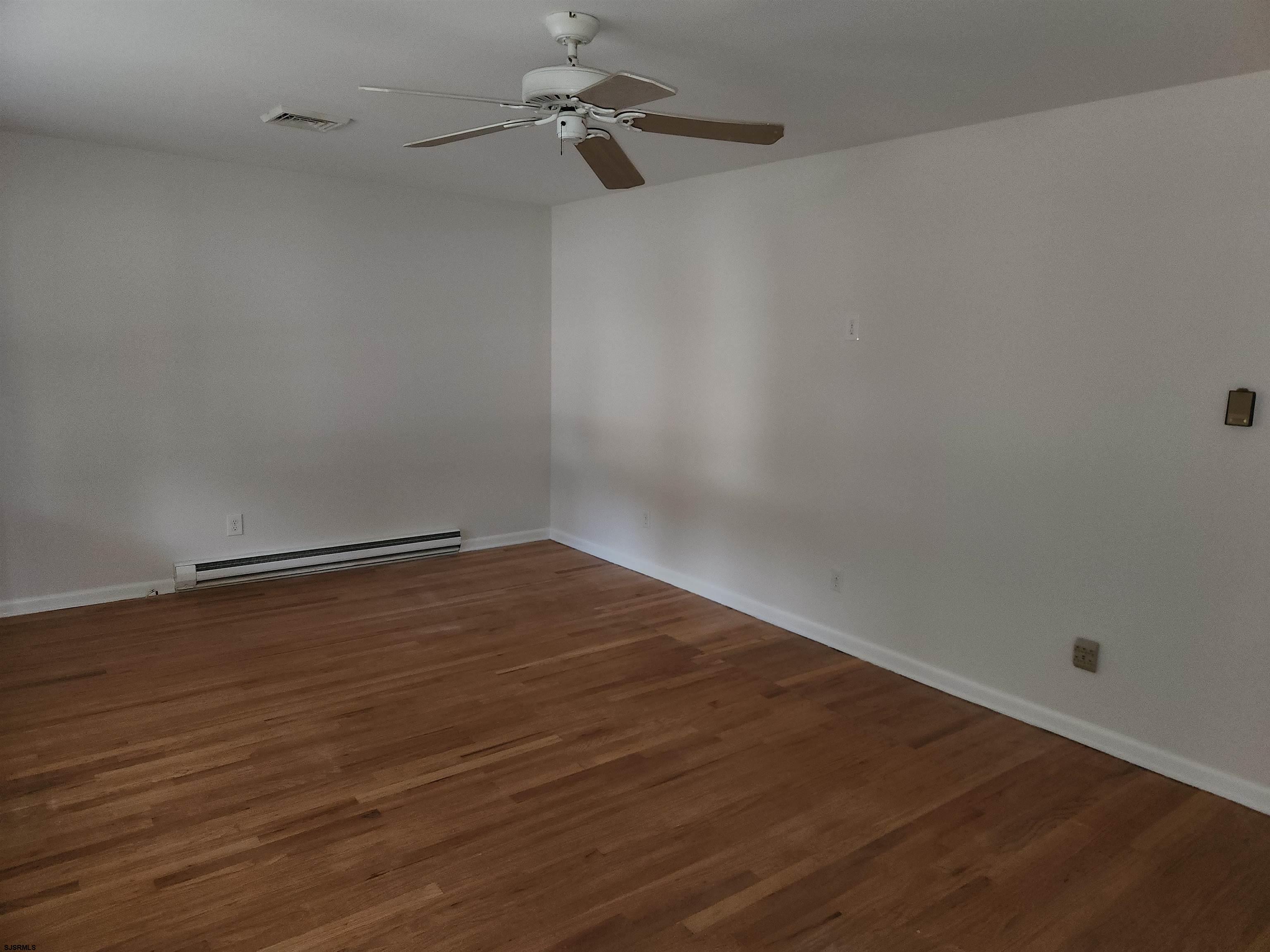 10 Point Pleasant Avenue Beesleys Point, NJ 08223 - Photo 6 of 16 a view of an empty room with wooden floor