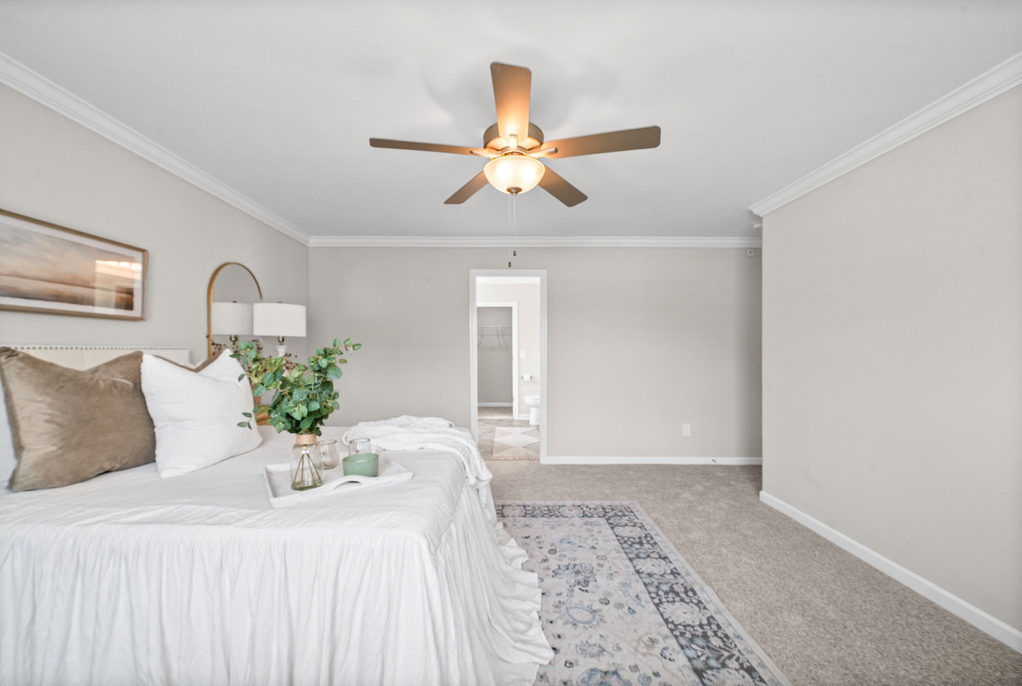 719 Reflections Lane Pleasant View, TN 37146 - Photo 20 of 46 a bedroom with a large bed and a chandelier fan