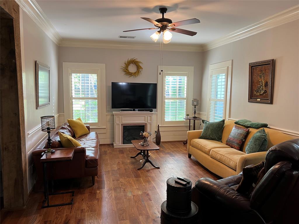 701 Johnson Street Terrell, TX 75160 - Photo 10 of 33 Stately plantation shutters and decorative fireplace