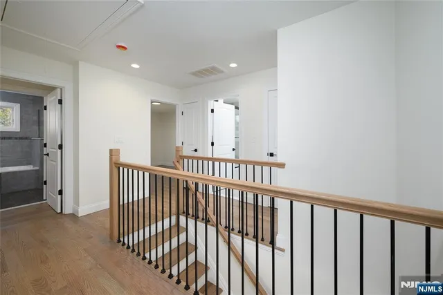 a view of a hallway with windows