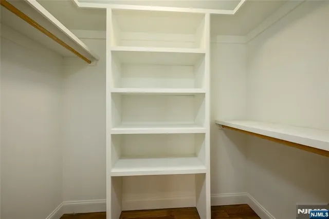 a shelf with a lamp on shelf