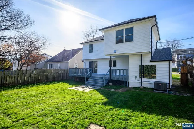 a house view with a sitting space and garden