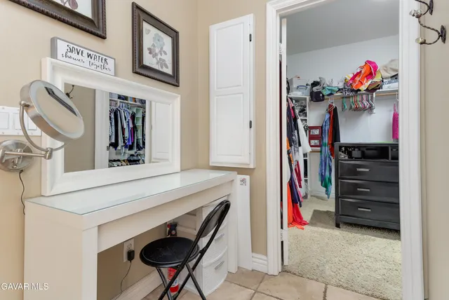 a view of a closet with storage