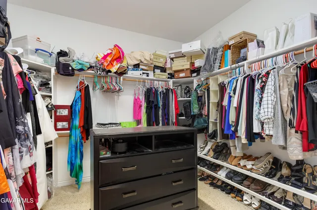 a bedroom with bed and a window