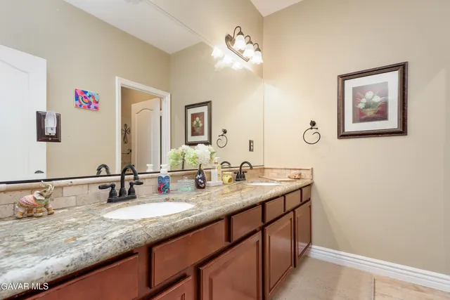 a white toilet sitting next to a bath tub