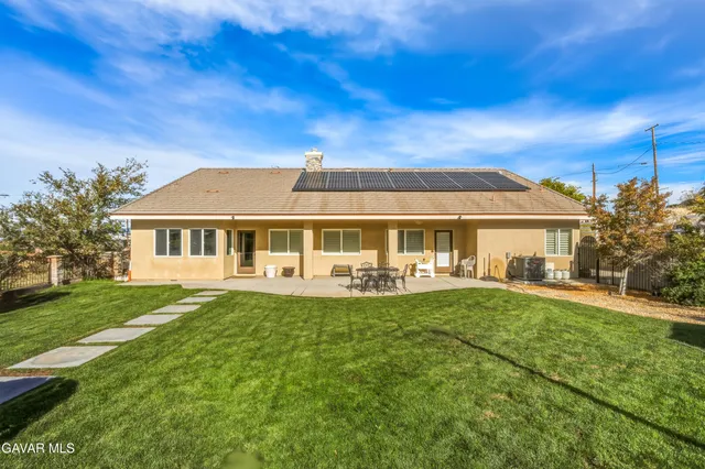 a front view of house with yard patio and green space