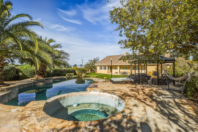 a view of a house with swimming pool
