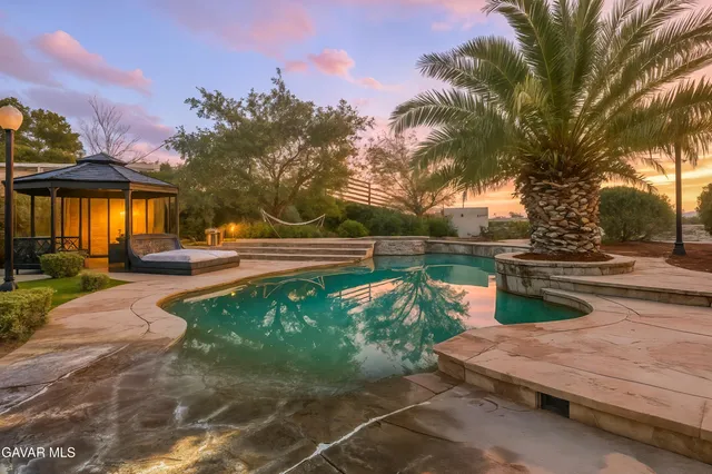 a garden view with a fountain