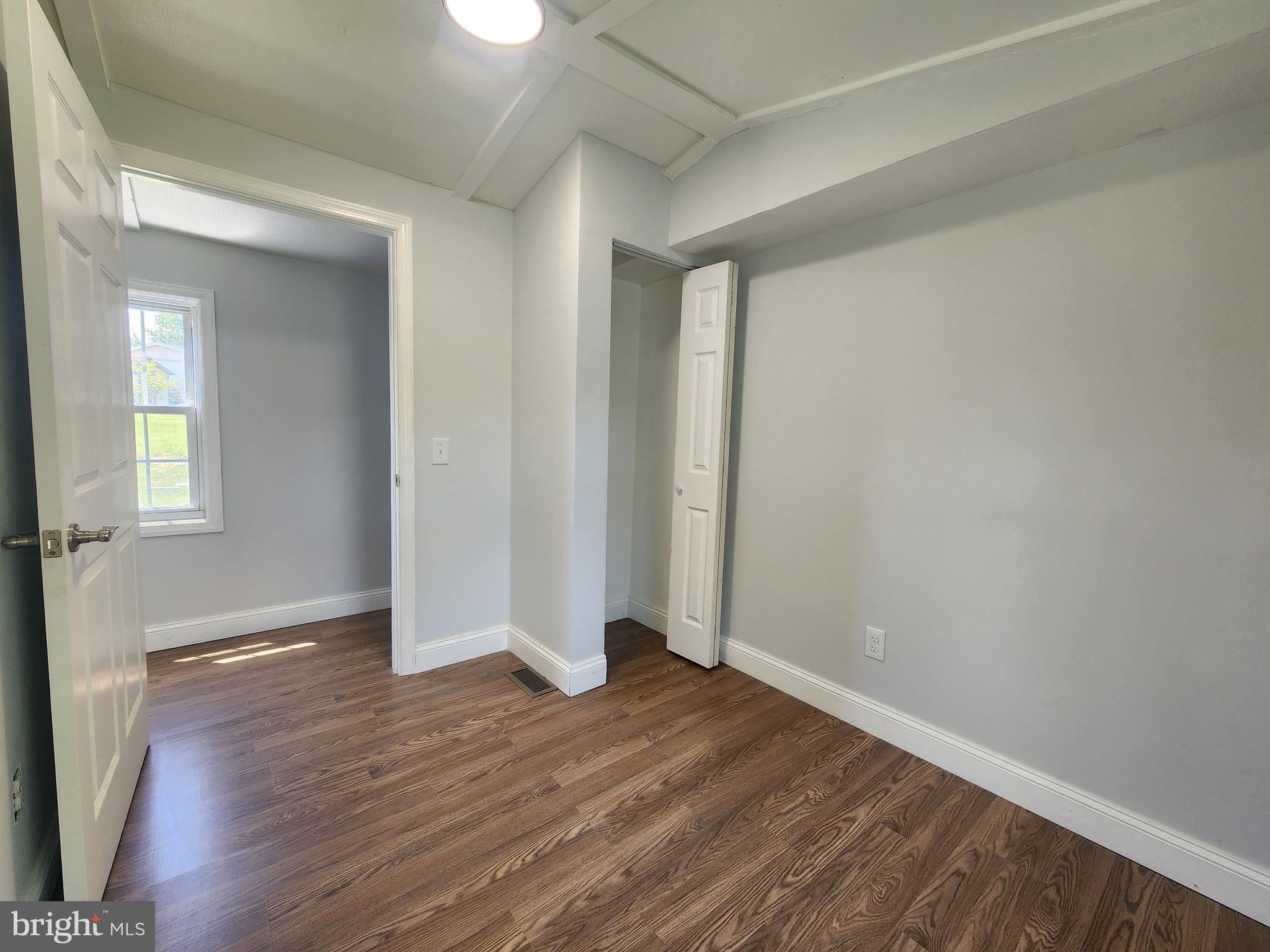 41 Mountain View Terrace Newville, PA 17241 - Photo 20 of 34 an empty room with wooden floor and windows