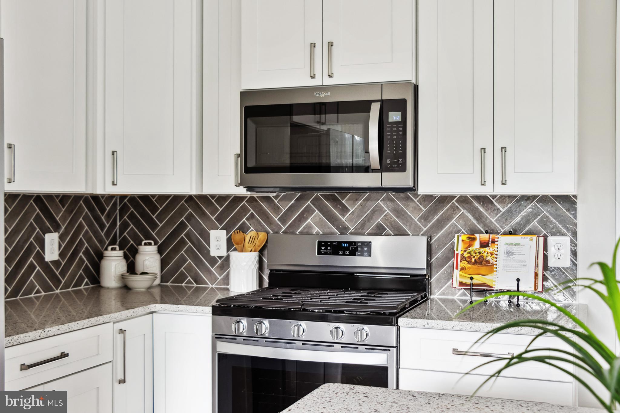 10678 Old Bond Mill Road Laurel, MD 20723 - Photo 16 of 40 Gas Cooking and custom tile backsplash
