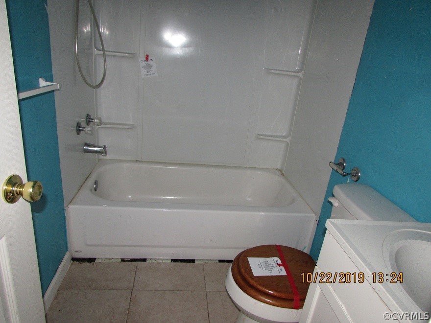 14704 Madison Road Dewitt, VA 23840 - Photo 13 of 20 a bathroom with a bathtub a toilet and a shower