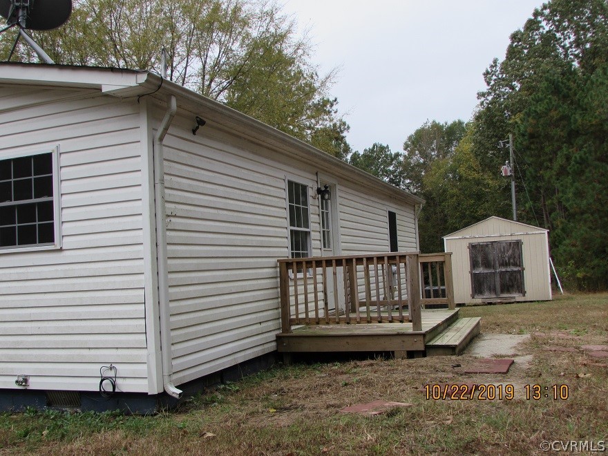 14704 Madison Road Dewitt, VA 23840 - Photo 3 of 20 a view of a back yard of the house