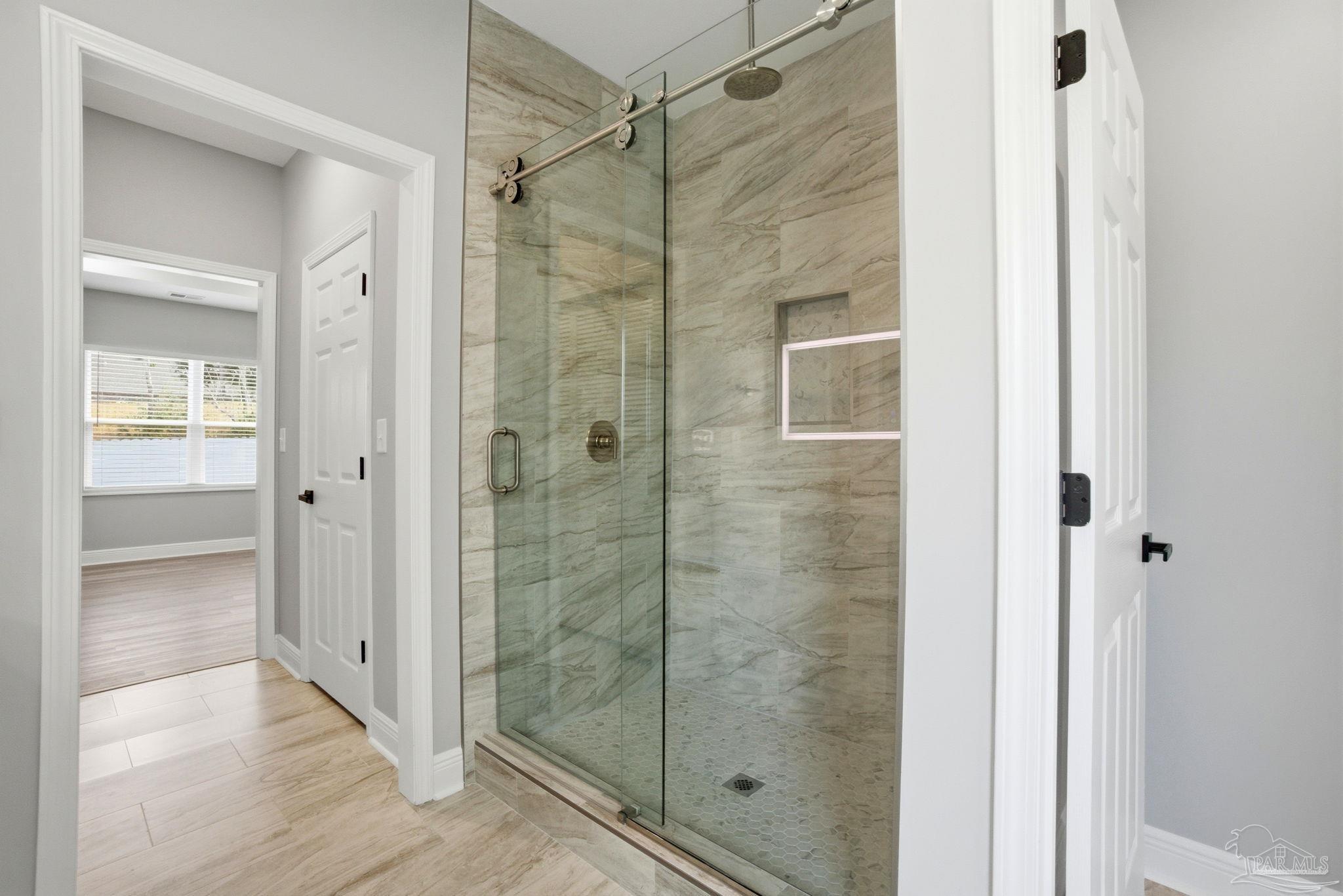 5712 Riviera Drive Milton, FL 32583 - Photo 28 of 41 a bathroom with a shower