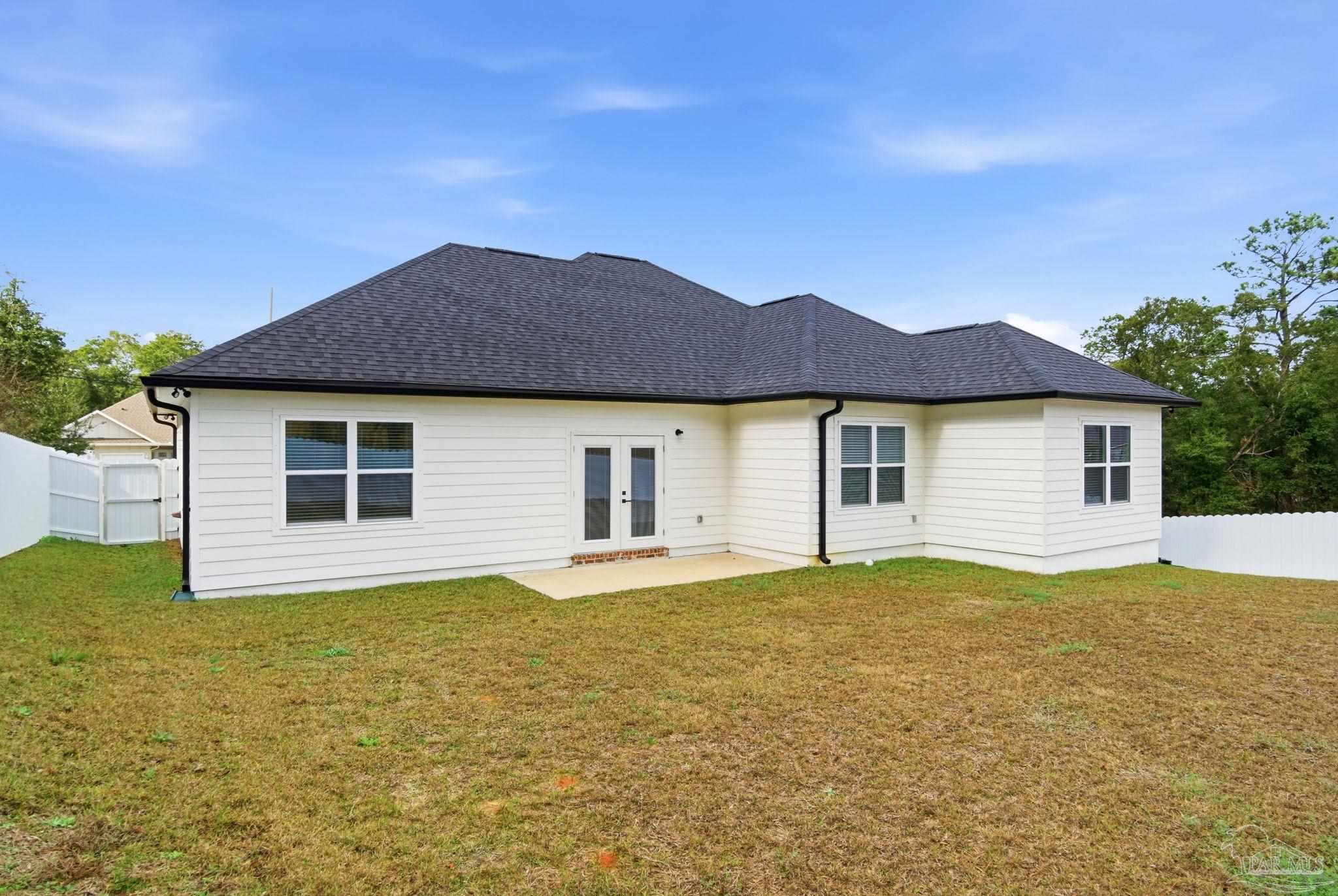 5712 Riviera Drive Milton, FL 32583 - Photo 38 of 41 a house view with a garden space