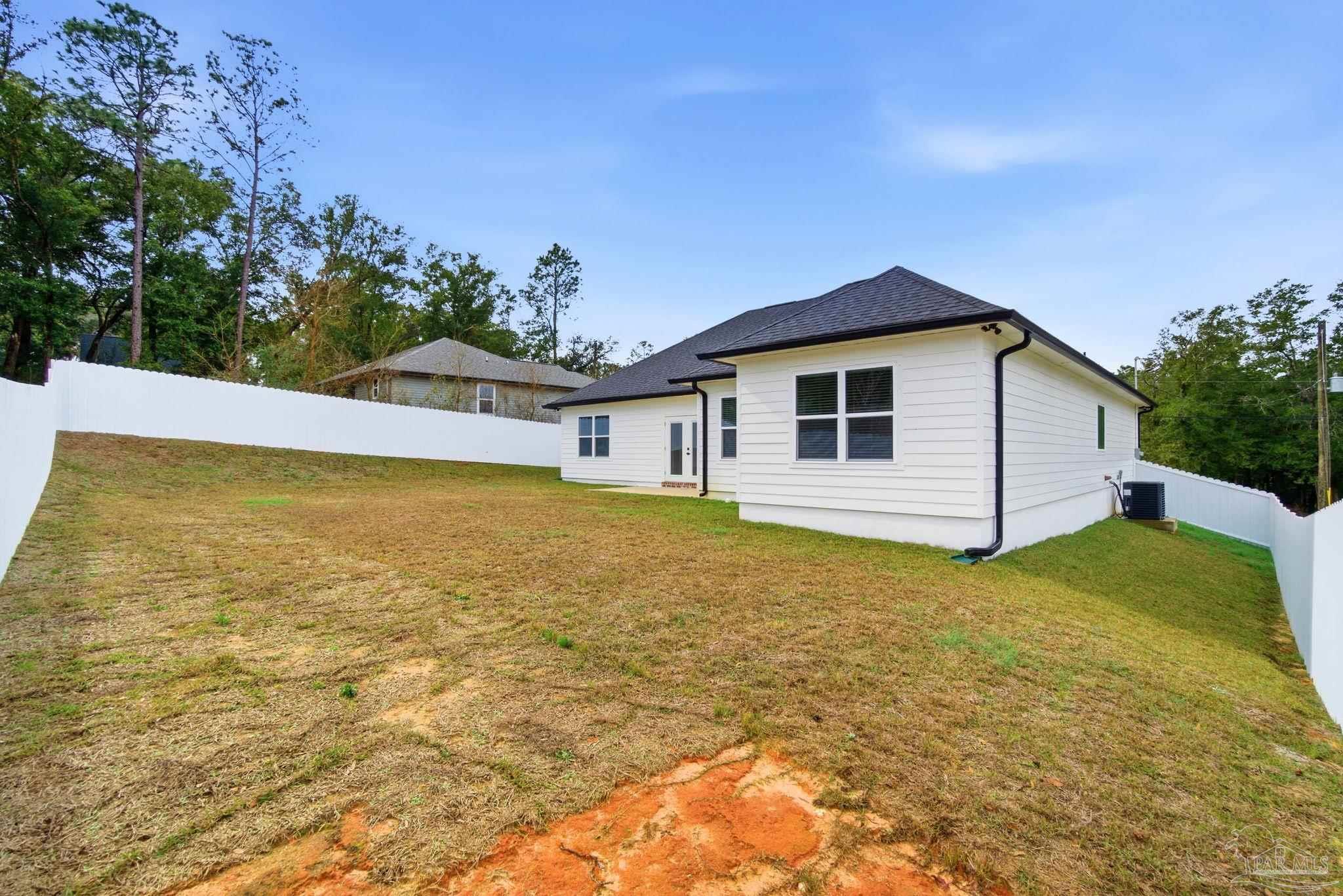5712 Riviera Drive Milton, FL 32583 - Photo 39 of 41 a view of a house with a backyard