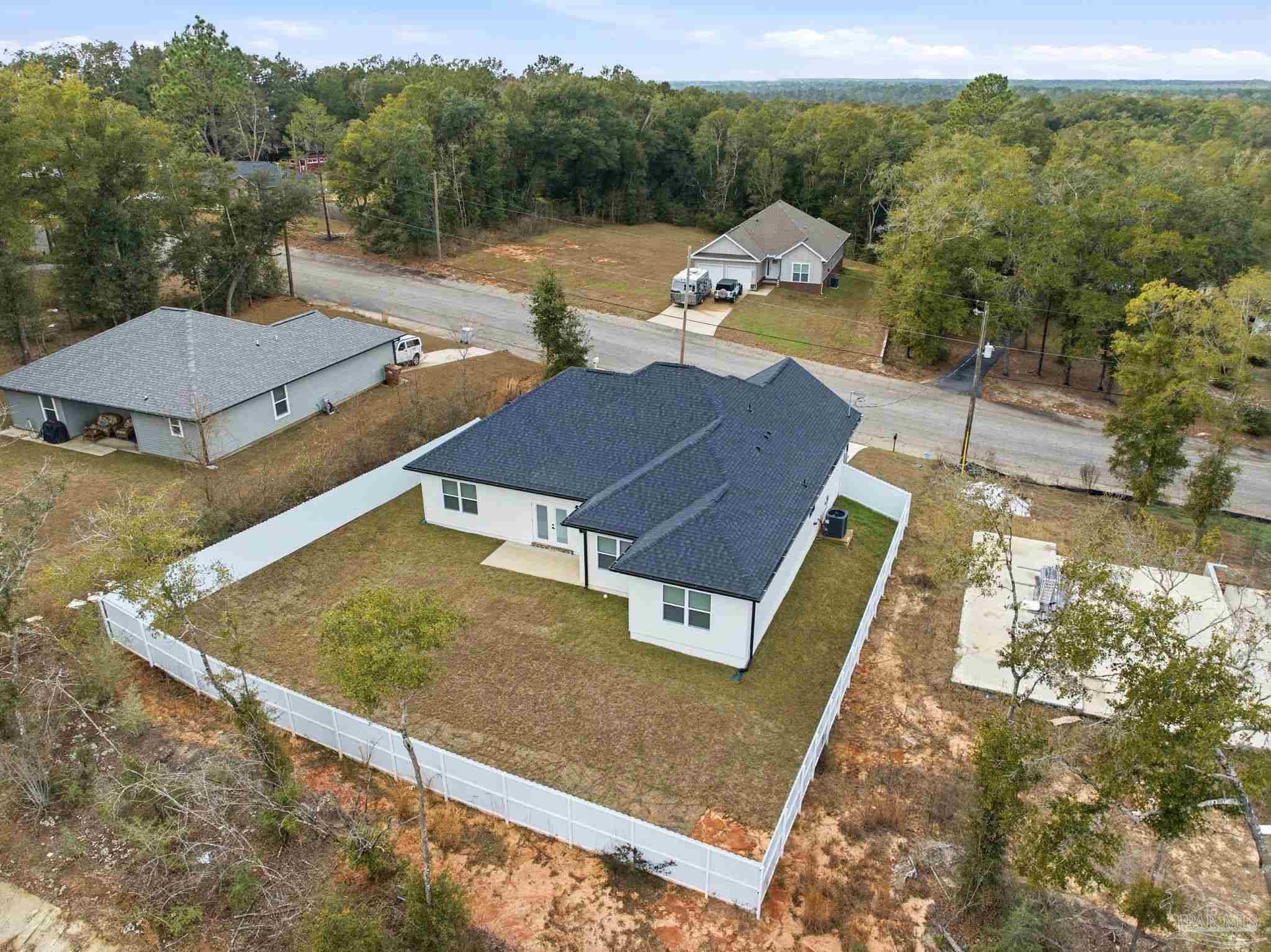 5712 Riviera Drive Milton, FL 32583 - Photo 40 of 41 an aerial view of a house with a yard