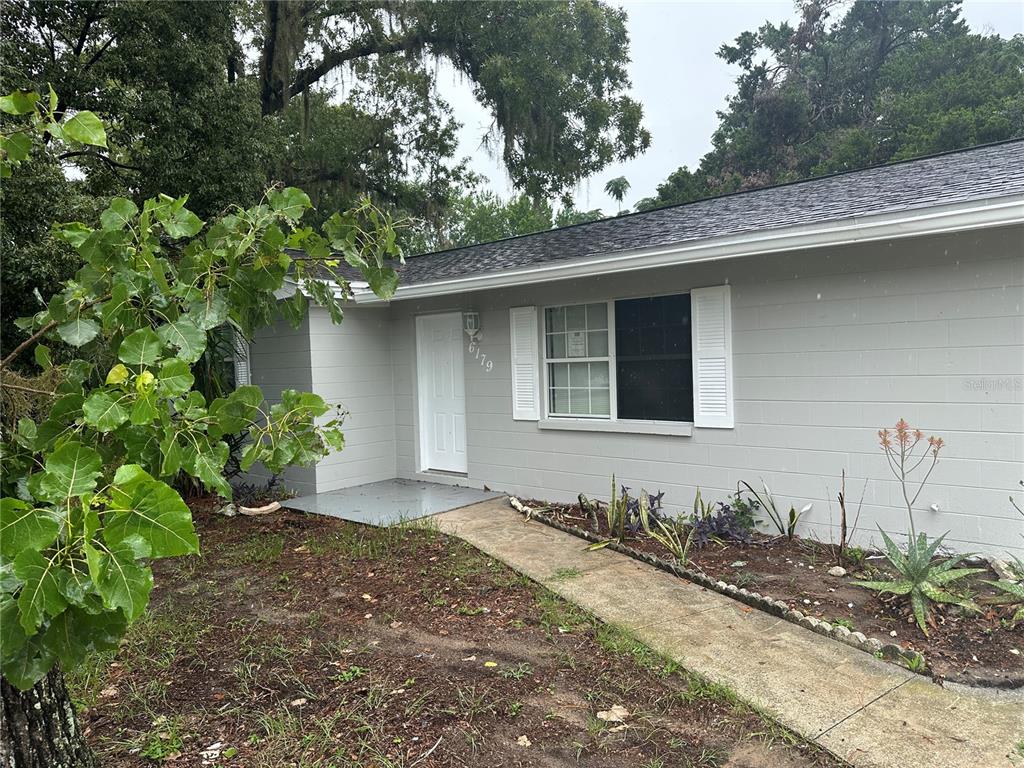 6179 West Star Court Homosassa, FL 34446 - Photo 1 of 21 a front view of a house with a yard