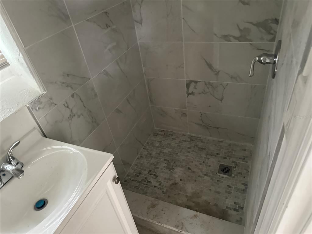 6179 West Star Court Homosassa, FL 34446 - Photo 12 of 21 a bathroom with a sink and shower