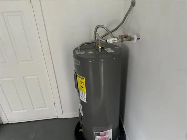 a view of storage and utility room with a sink