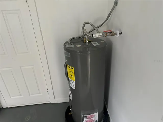 a view of storage and utility room with a sink