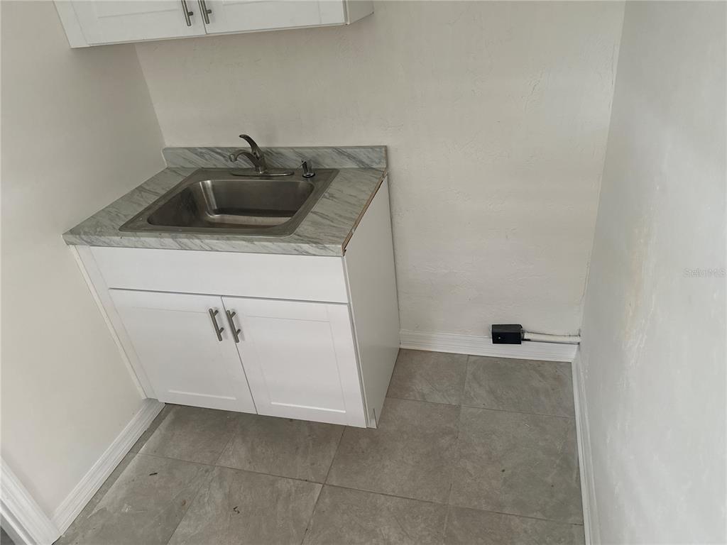 6179 West Star Court Homosassa, FL 34446 - Photo 7 of 21 a kitchen with a sink and cabinets