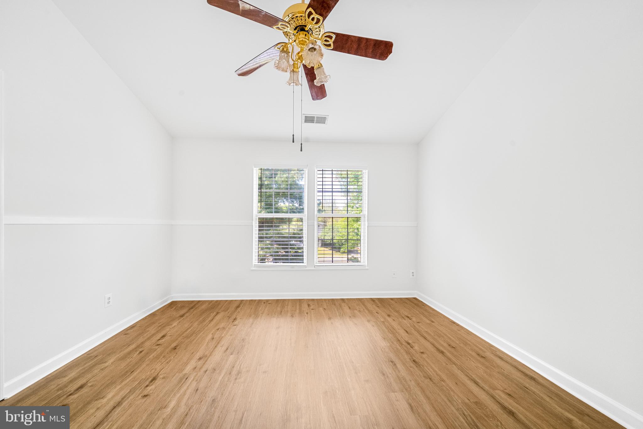 8596 Cold Harbor Loop Manassas, VA 20111 - Photo 22 of 52 an empty room with a window and wooden floor