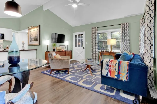 a living room with furniture and a flat screen tv