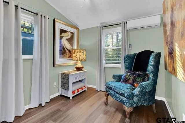 a view of a wooden door and a tree