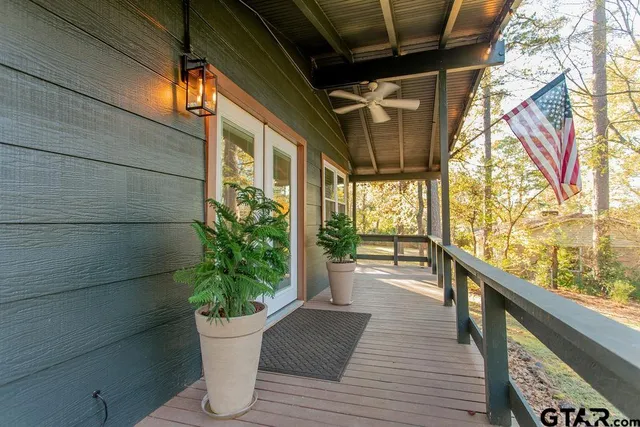 a view of a porch with potted plants