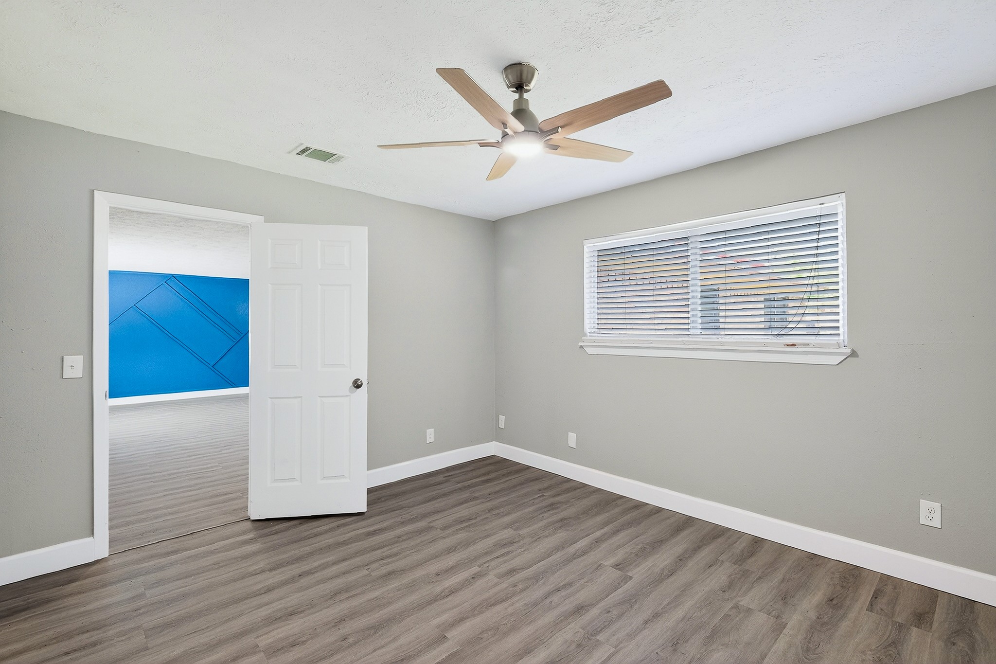 2510 Marble Falls Drive Spring, TX 77373 - Photo 20 of 26 wooden floor in an empty room with a window
