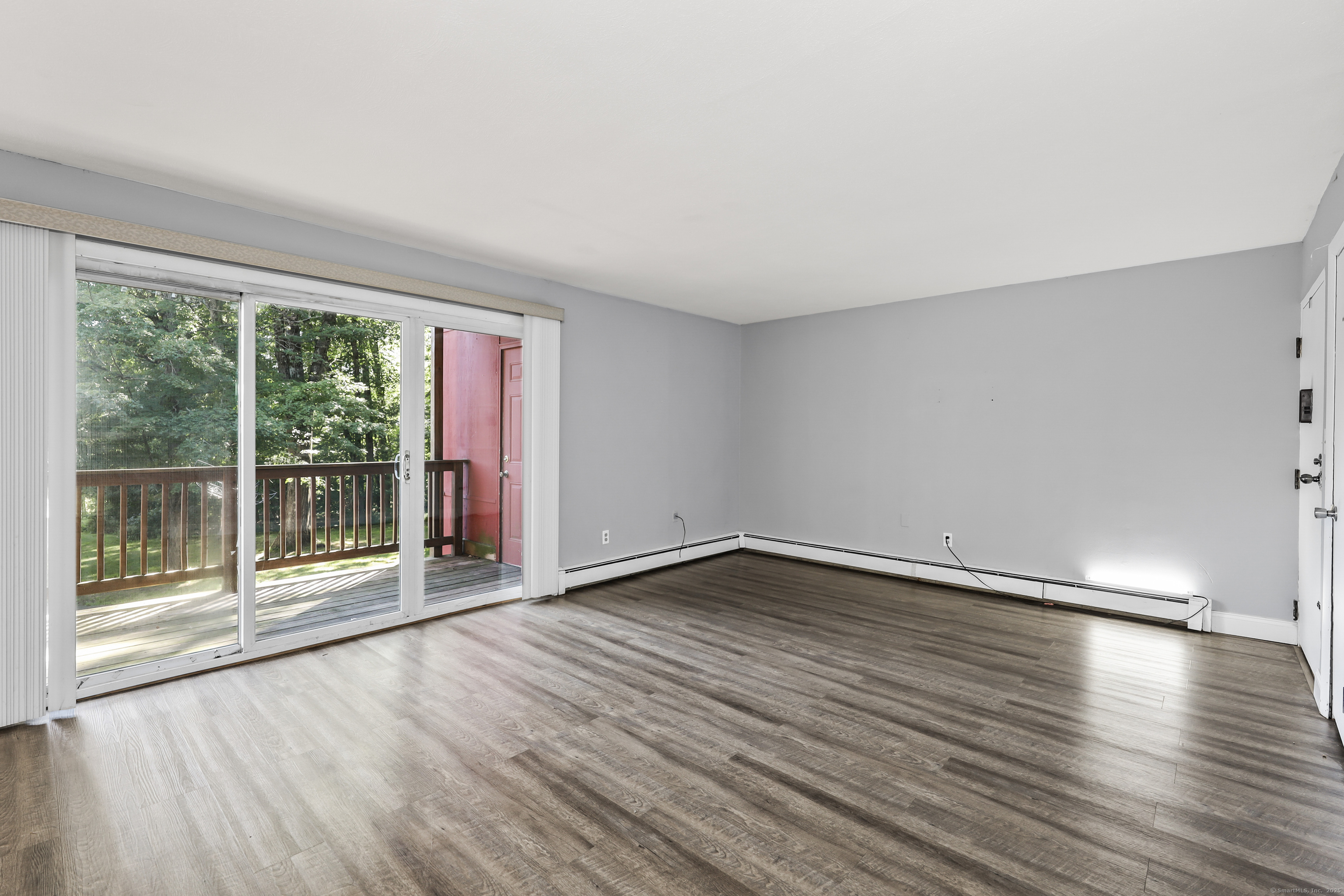 1109 Waterbury Road, Unit 1A Cheshire, CT 06410 - Photo 1 of 1 wooden floor in an empty room with a window